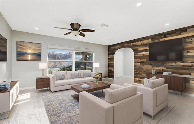 1190 Victoria Ave NW, Port Charlotte, FL 33948 - living room featuring a ceiling fan, visible vents, wooden walls, an accent wall, and recessed lighting