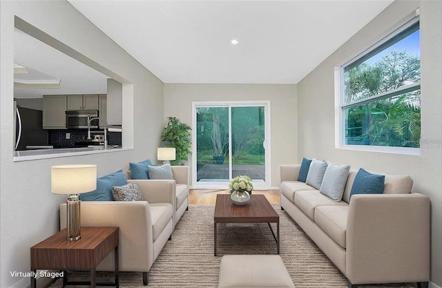 1190 Victoria Ave NW, Port Charlotte, FL 33948 - living room featuring recessed lighting and wood finished floors