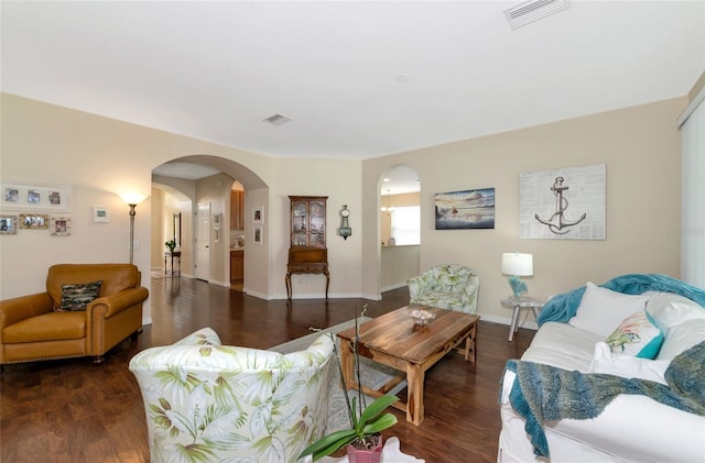 living room featuring dark wood-type flooring