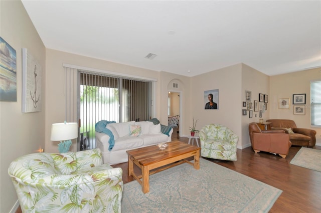 living room with dark hardwood / wood-style floors