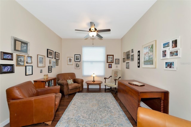 living room featuring dark hardwood / wood-style floors and ceiling fan