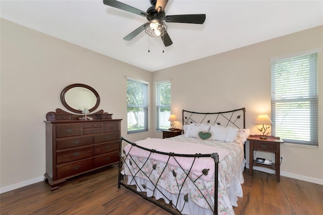 bedroom with ceiling fan and dark wood-type flooring