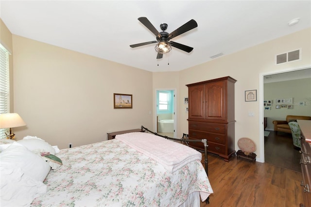 bedroom with dark hardwood / wood-style floors and ceiling fan