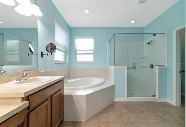 bathroom featuring tile patterned floors, vanity, and independent shower and bath