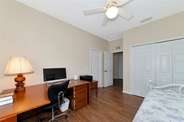 home office with ceiling fan and dark hardwood / wood-style floors