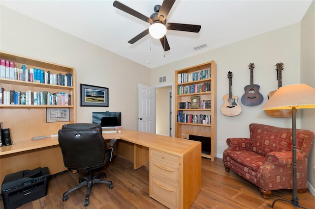 office area with light hardwood / wood-style floors and ceiling fan