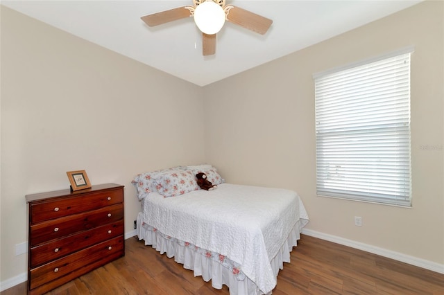 bedroom featuring ceiling fan and dark hardwood / wood-style floors