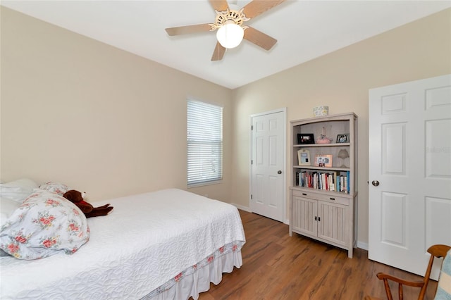 bedroom featuring wood-type flooring and ceiling fan