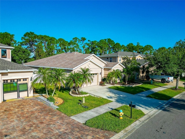 view of front facade with a garage and a front yard