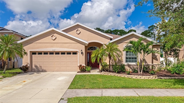 single story home featuring a garage and a front lawn