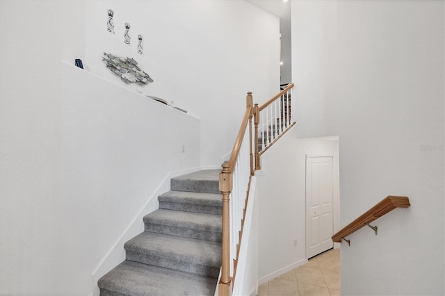 staircase with tile patterned flooring