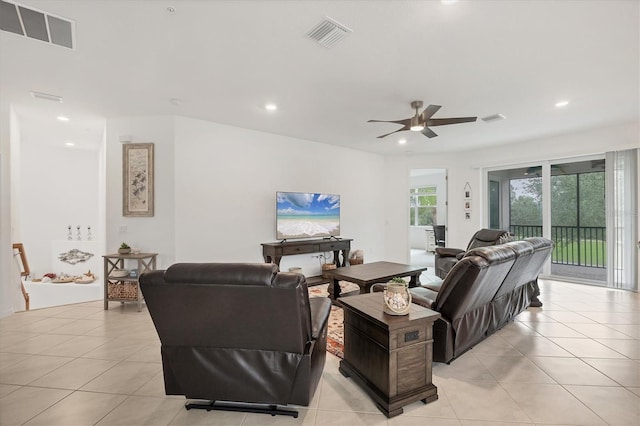 living room featuring ceiling fan and light tile patterned floors