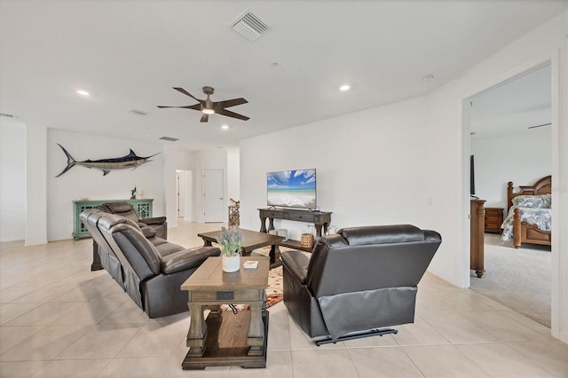 tiled living room with ceiling fan