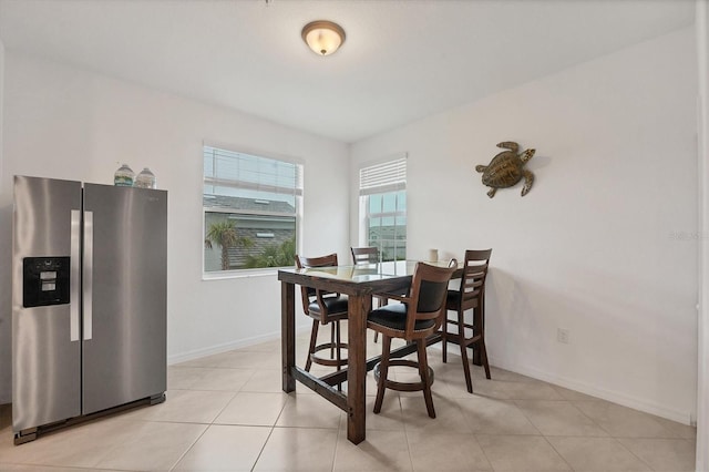 dining room featuring light tile patterned flooring