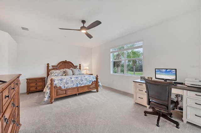 bedroom featuring light carpet and ceiling fan