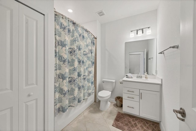 full bathroom featuring tile patterned floors, vanity, toilet, and shower / tub combo with curtain