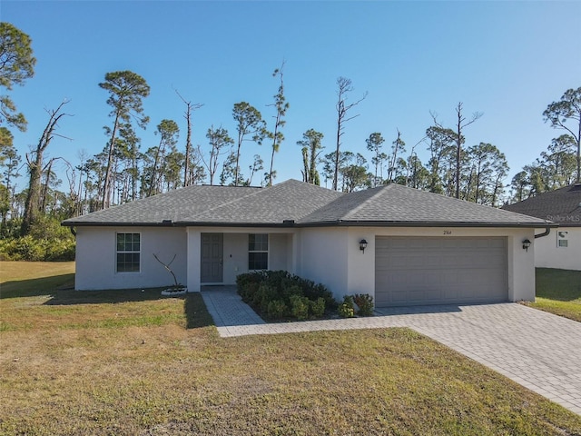 single story home featuring a front lawn and a garage