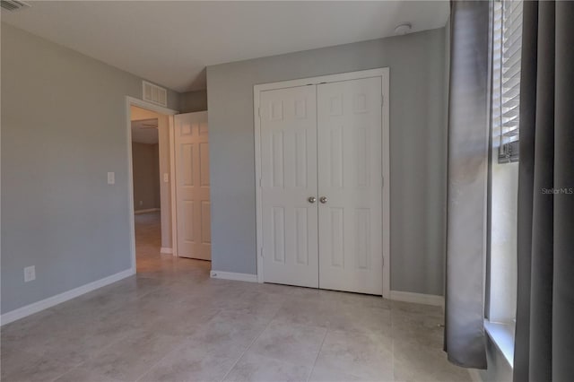 unfurnished bedroom with a closet