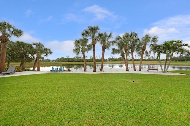 exterior space with a lawn and a water view