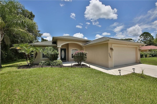 view of front facade with a front lawn and a garage