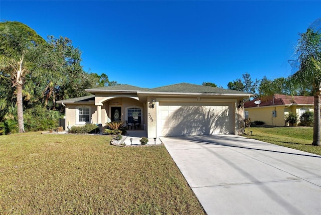 view of front of house with a front yard and a garage