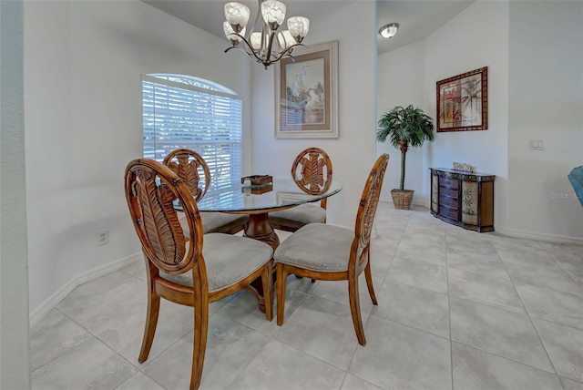 tiled dining space featuring a chandelier