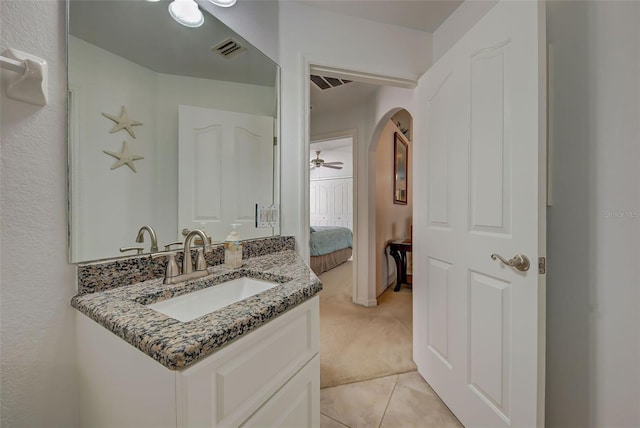 bathroom with tile patterned floors and vanity