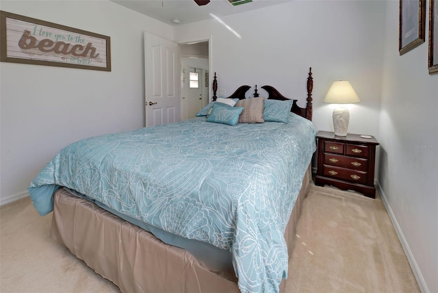 bedroom featuring light colored carpet and ceiling fan