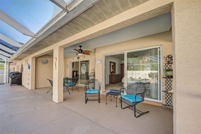 view of patio featuring ceiling fan