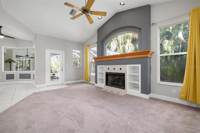 unfurnished living room with light carpet, vaulted ceiling, and ceiling fan