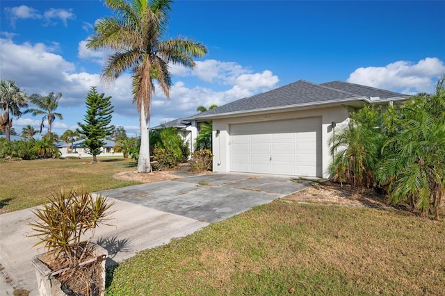 view of home's exterior with a garage and a lawn