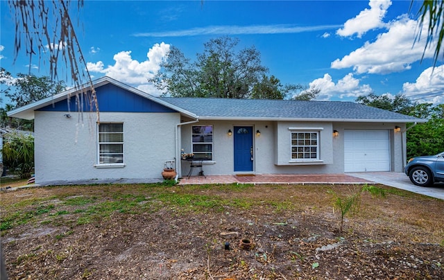 ranch-style house with a garage and a porch