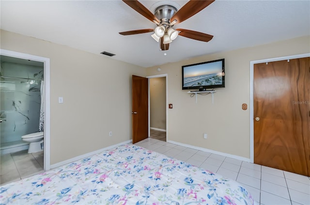 bedroom with ceiling fan, light tile patterned floors, and a closet