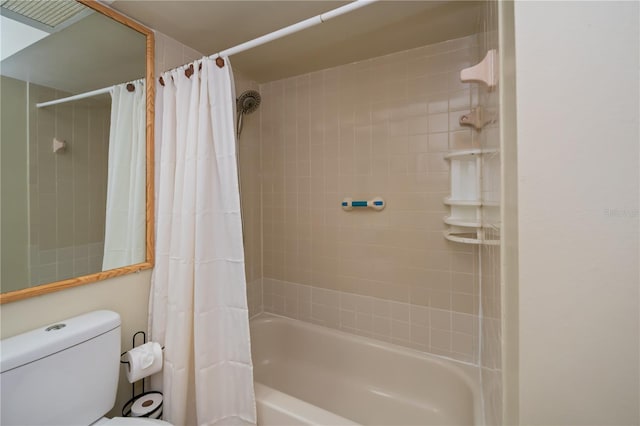 bathroom with toilet and shower / tub combo