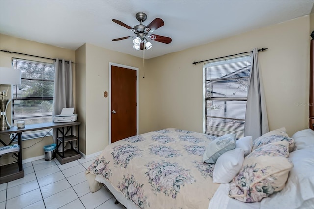 bedroom featuring ceiling fan and light tile patterned flooring