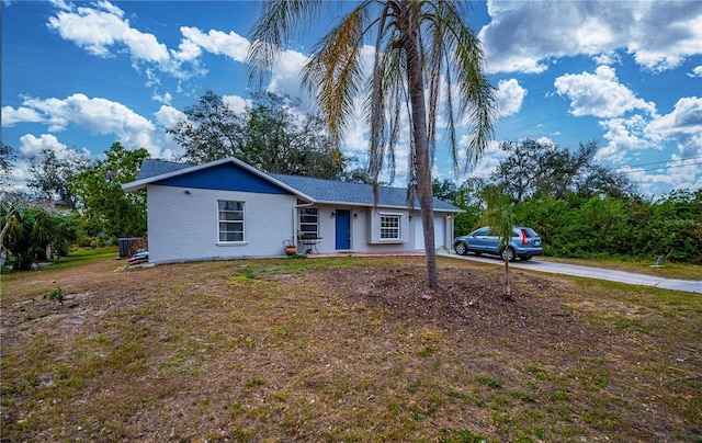 single story home featuring a garage