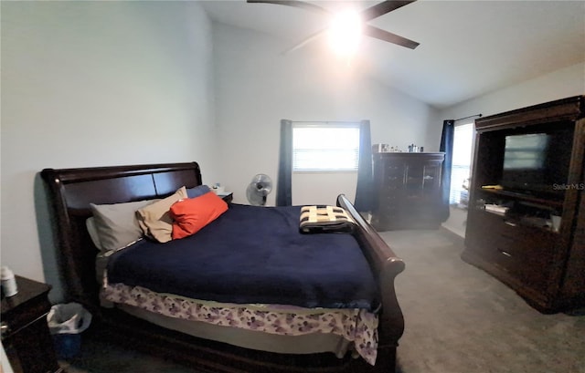 bedroom featuring carpet flooring, vaulted ceiling, and ceiling fan