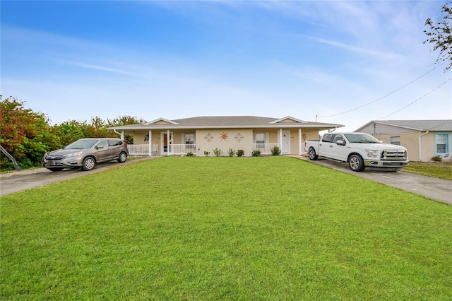 single story home featuring a porch and a front lawn