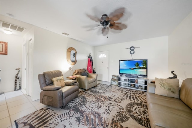 living room with ceiling fan and light tile patterned floors