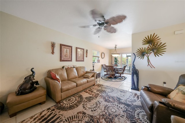 tiled living room featuring ceiling fan