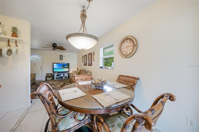 dining room with ceiling fan and light tile patterned floors