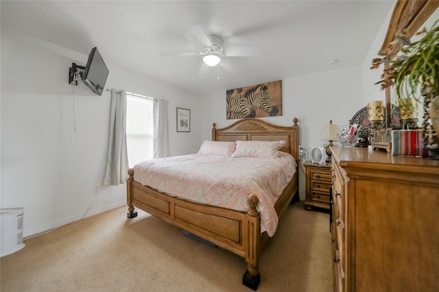 bedroom with ceiling fan and light colored carpet