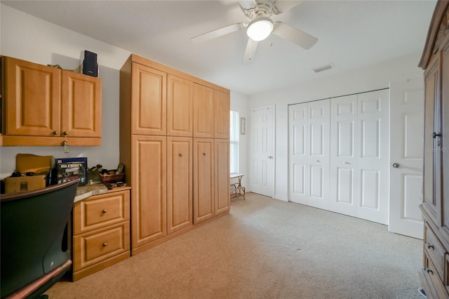 home office with ceiling fan and light colored carpet