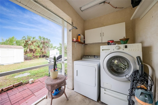 washroom with washer and dryer