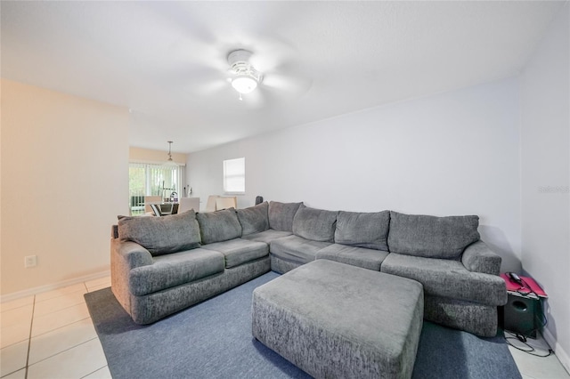 tiled living room with ceiling fan