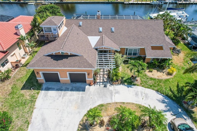 birds eye view of property with a water view