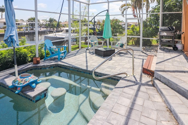 view of pool featuring a lanai, a grill, a water view, and a patio