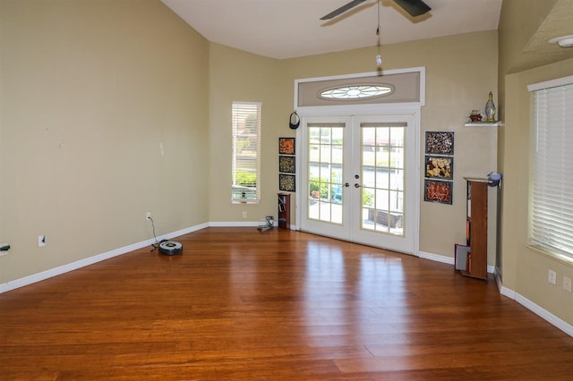 interior space featuring dark hardwood / wood-style floors, ceiling fan, and french doors