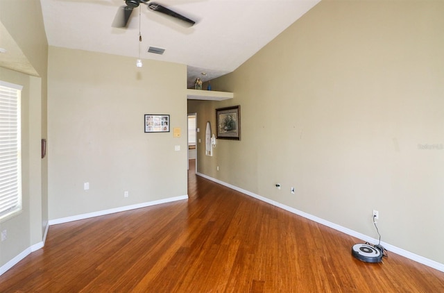 unfurnished room featuring hardwood / wood-style flooring, vaulted ceiling, and ceiling fan