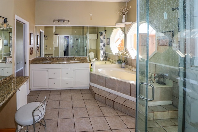 bathroom featuring separate shower and tub, tile patterned flooring, and vanity